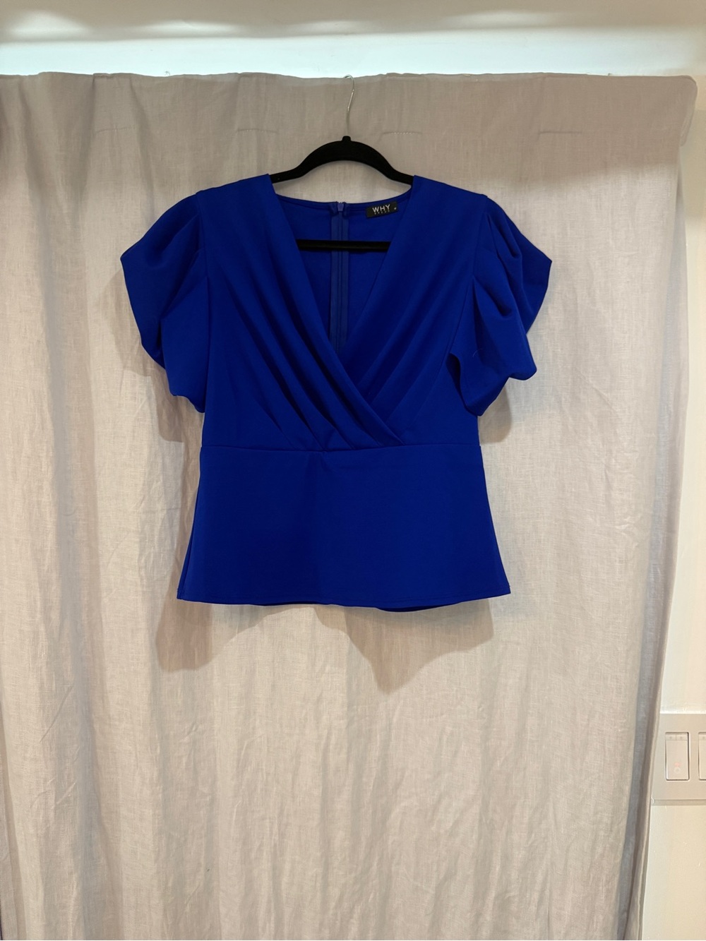 Classic faux wrap crepe top with dramatic sleeves. NWOT. Size M cobalt blue